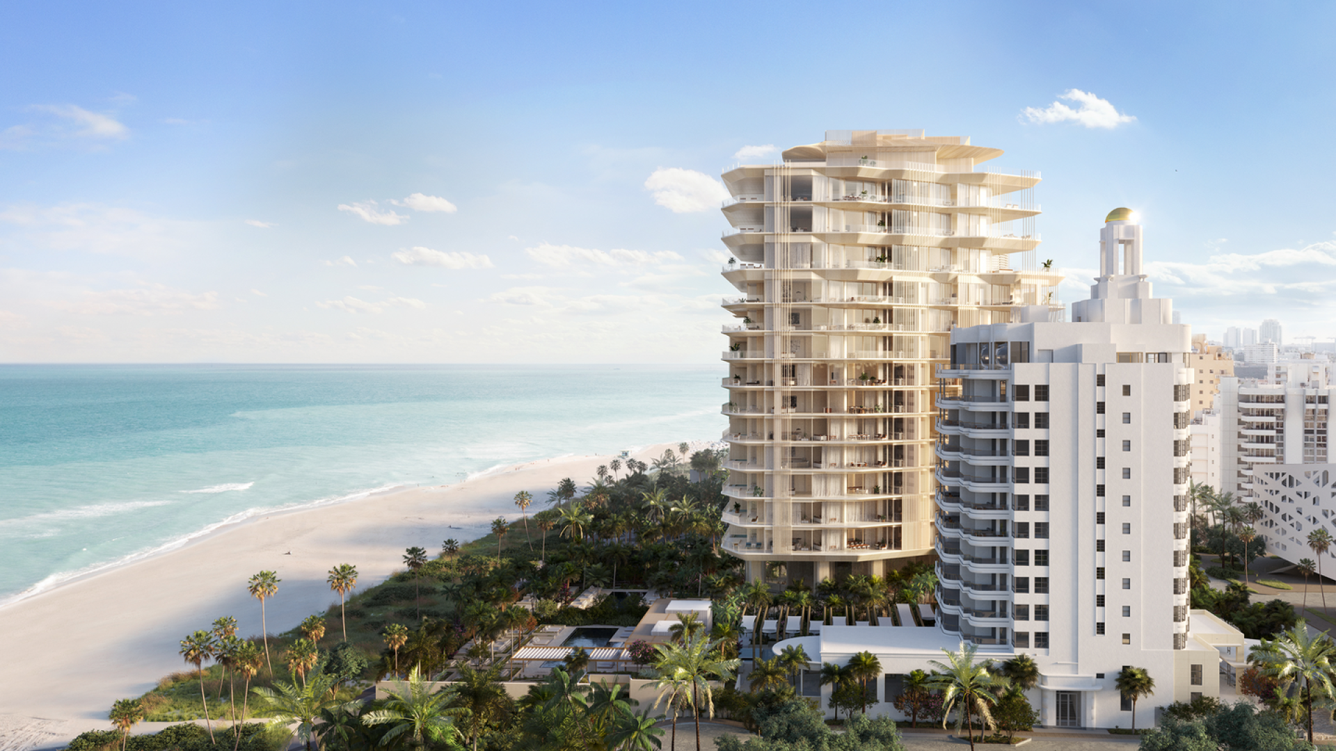 Beachfront view of a luxurious, modern high-rise, next to a historic white building.