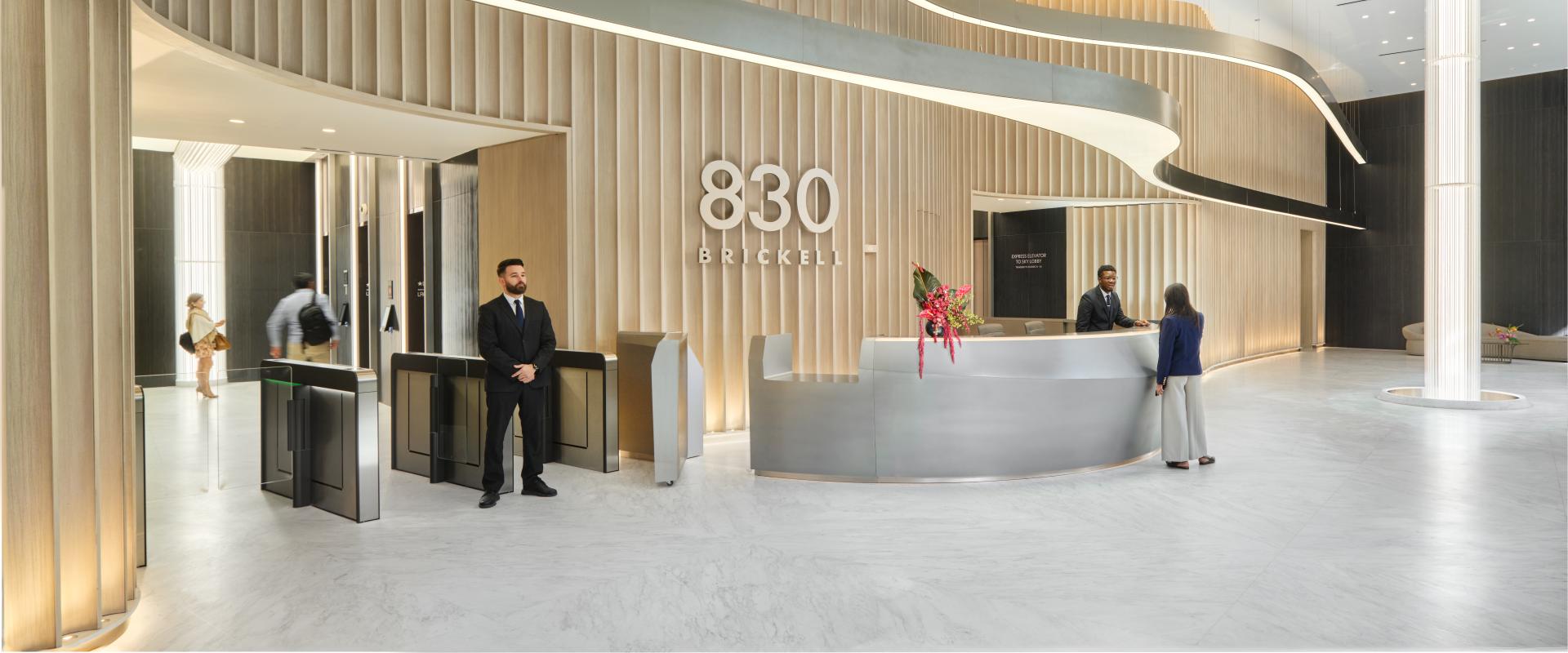 A modern, luxurious lobby interior with sleek, minimalist design elements.